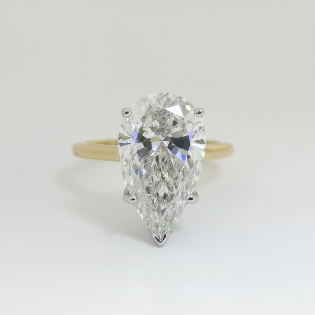 Diamond ring with pear-shaped stone