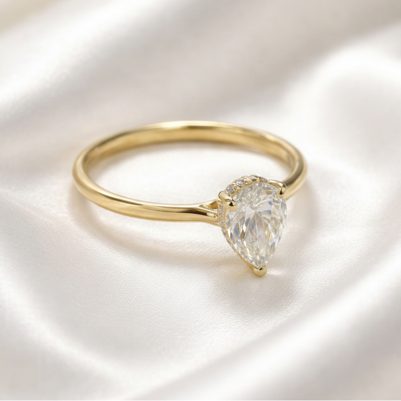 1.39 carat pear shaped diamond with hidden halo setting in yellow gold