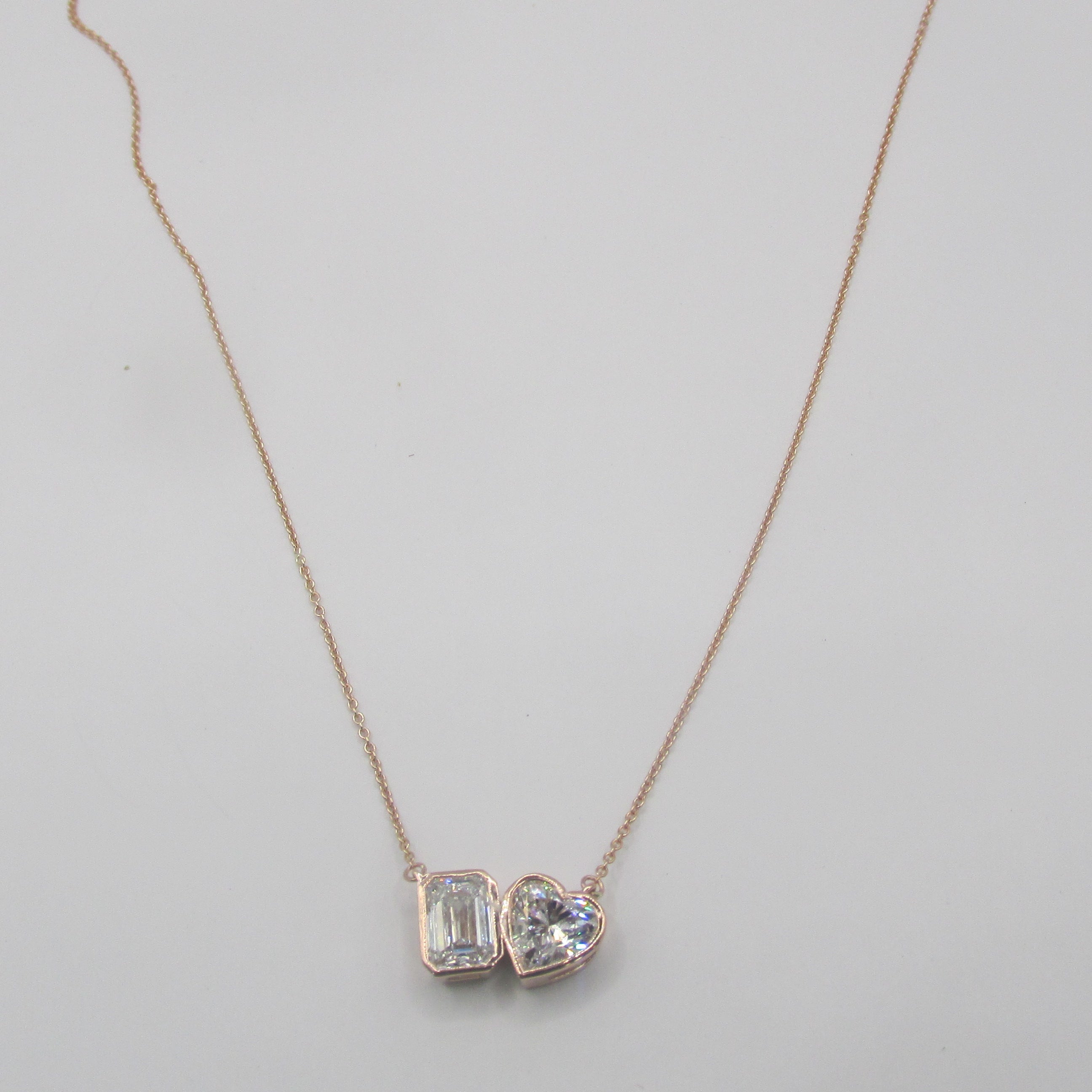 Elegant 14K Rose Gold Toi et Moi necklace featuring two large, sparkling lab-grown diamonds side by side