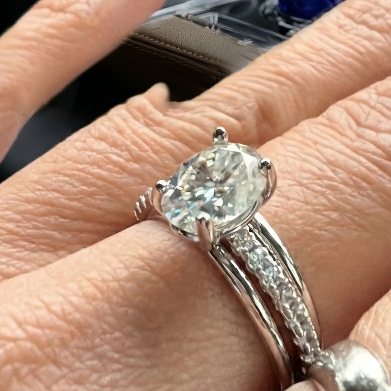 Close-up of a hand wearing a diamond ring