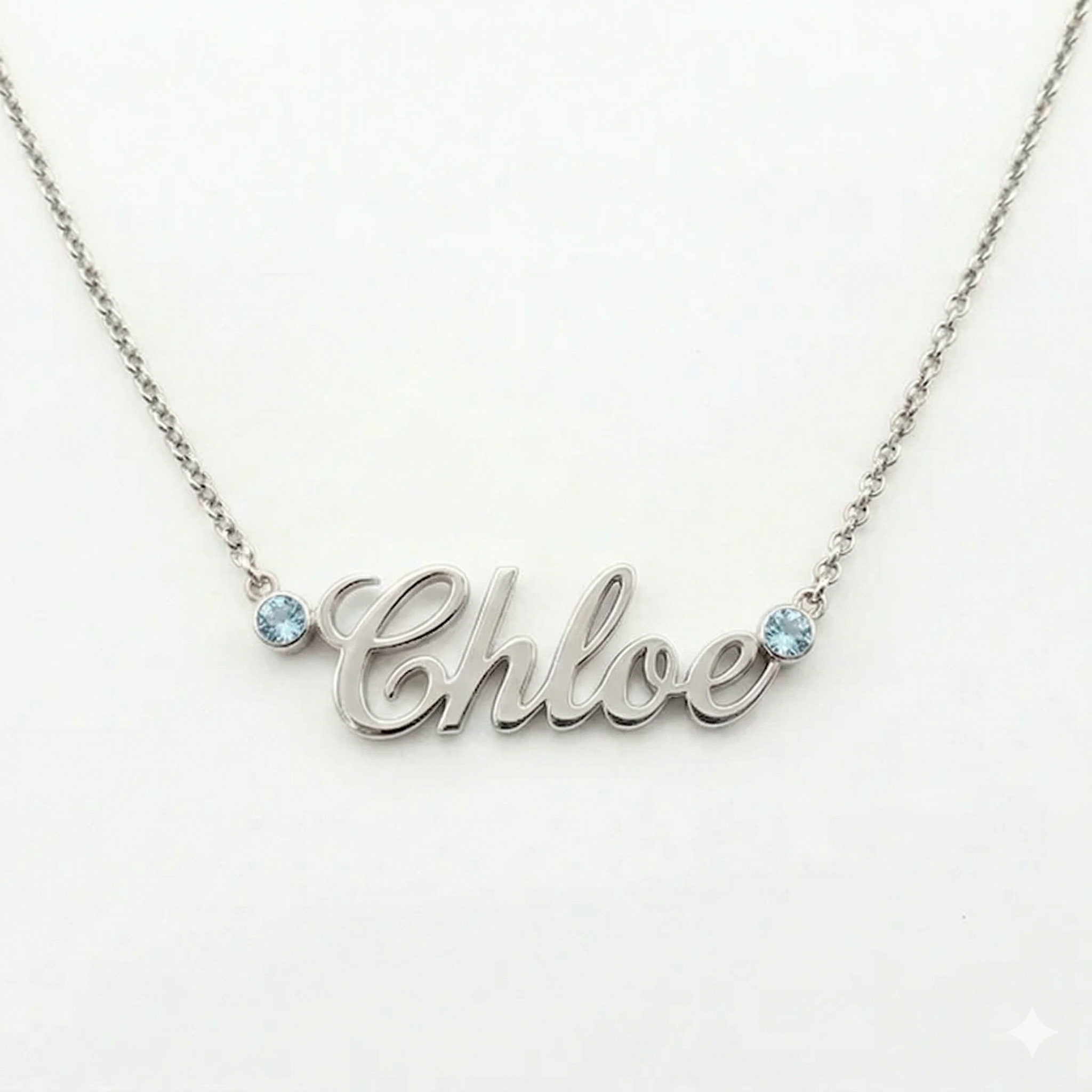 Yellow gold necklace with aquamarine accents featuring a "Chloe" pendant