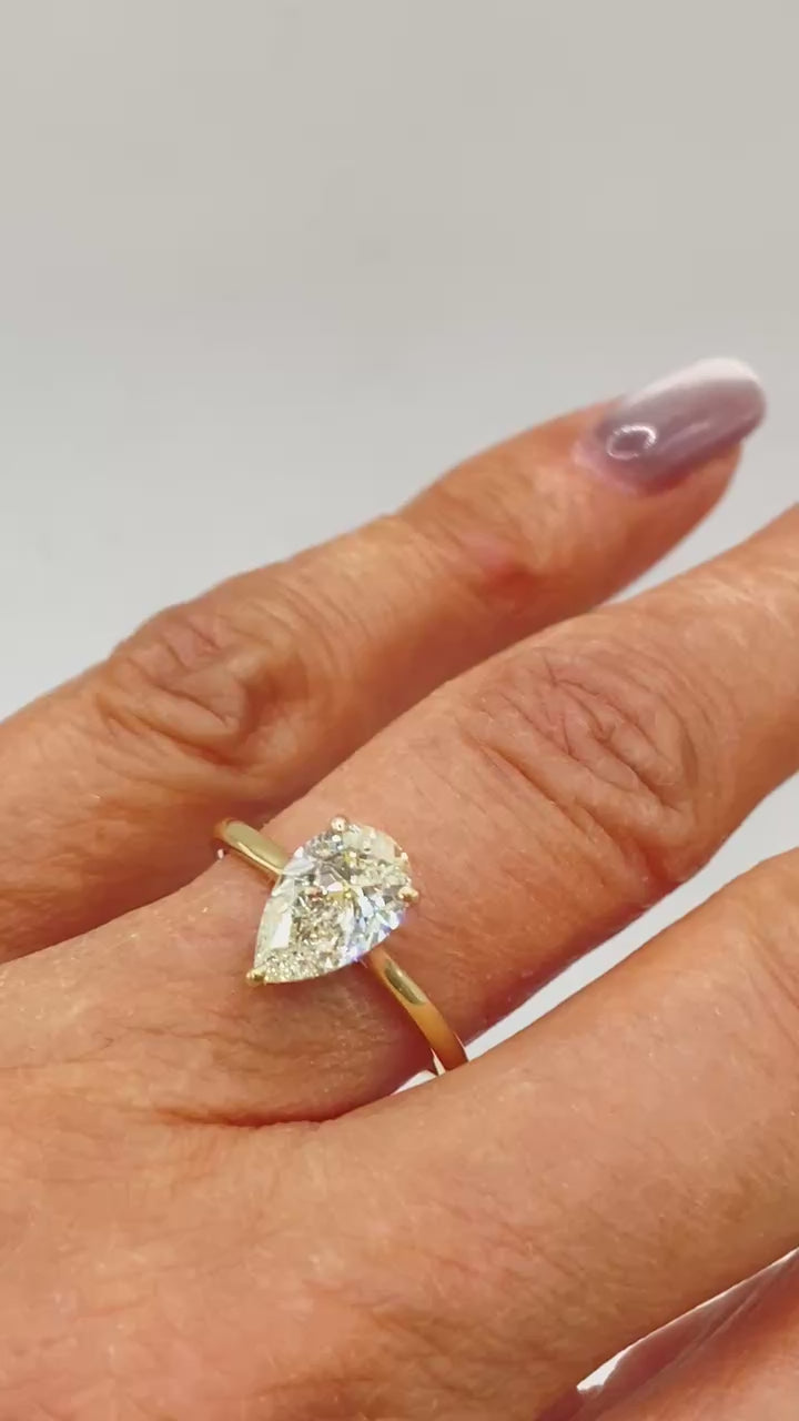 Pear Engagement Ring on Hand