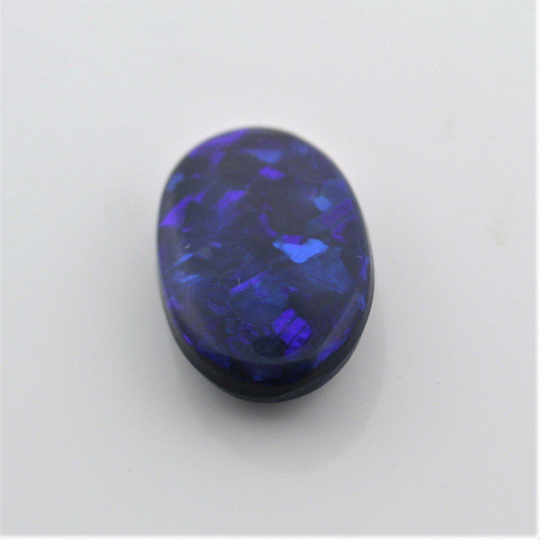 5.44 carat Black Opal Oval Flat Cabochon Blue Play of color - Thenetjeweler