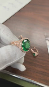 Emerald ring with diamond halo